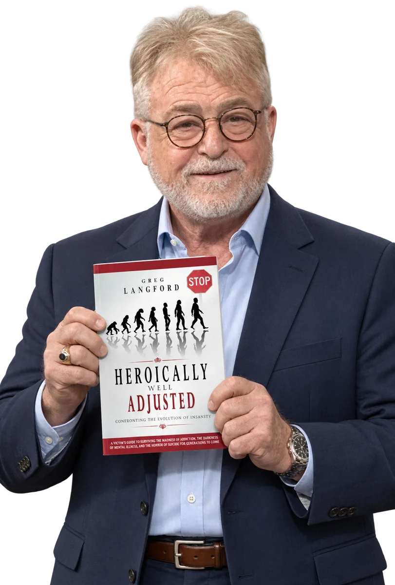 Greg Langford holding his book Heroically Well Adjusted